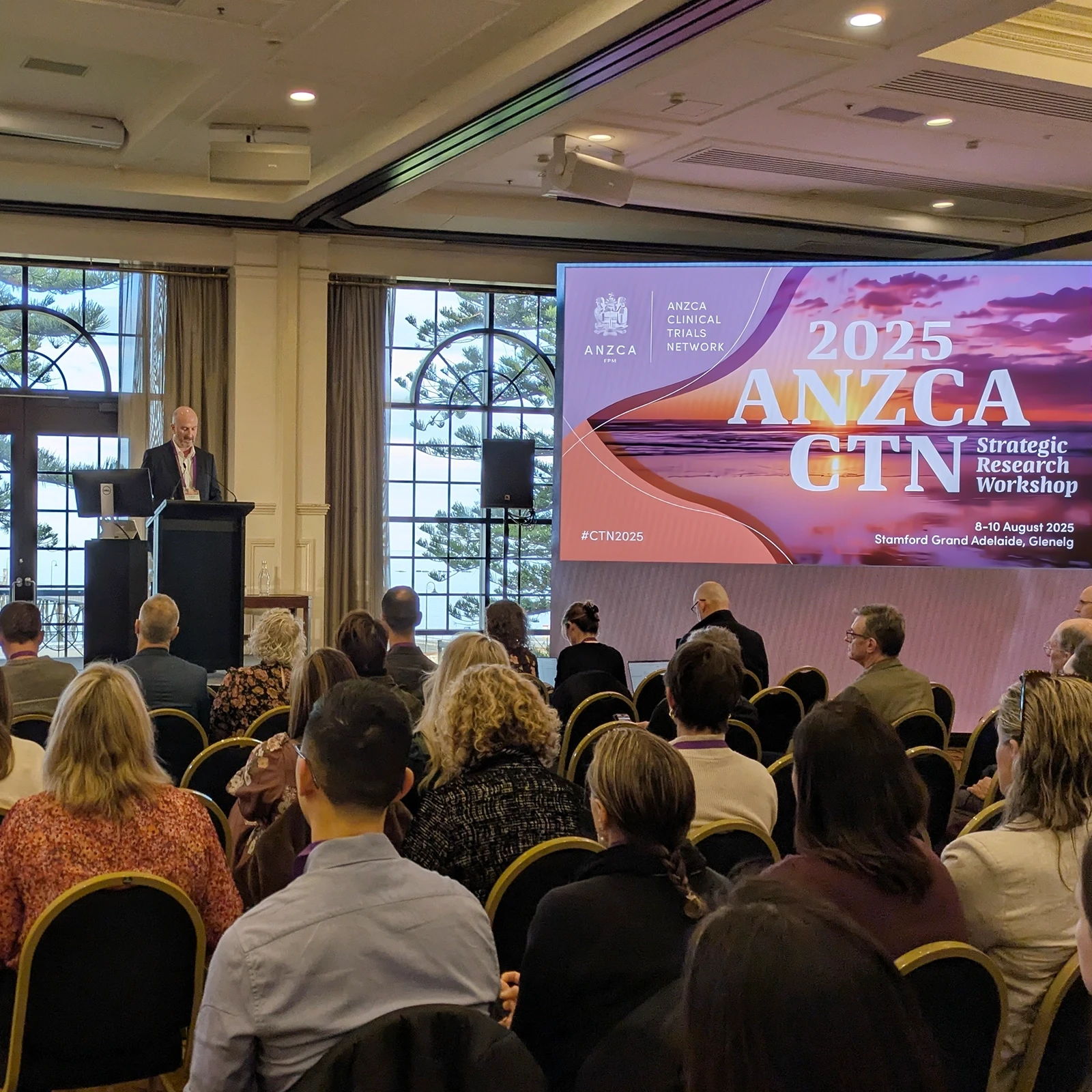 Dr Michael Cusack presenting at the 2025 CTN workshop in Glenelg, SA, to a large audience