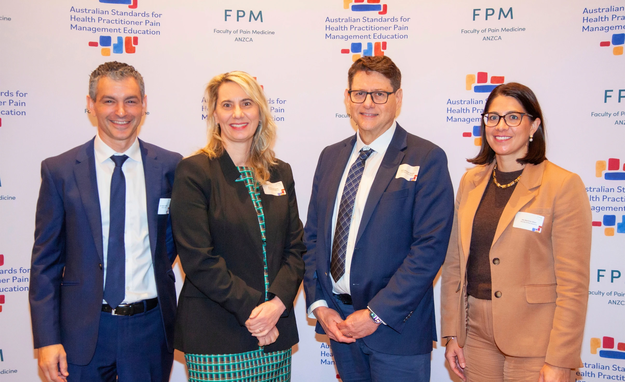 FPM leadership in front of the FPM media wall at the 2026 FPM National Pain Education Summit