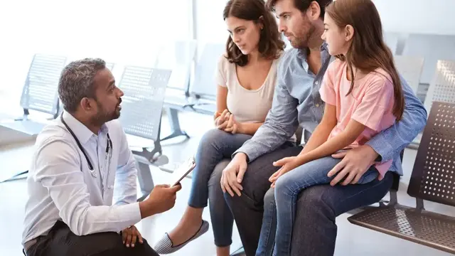 Doctor talking to a family