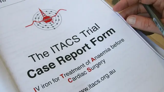 A close-up of a document titled "The ITACS Trial Case Report Form," focusing on IV iron treatment for anemia before cardiac surgery, with a hand holding a pen in the corner.