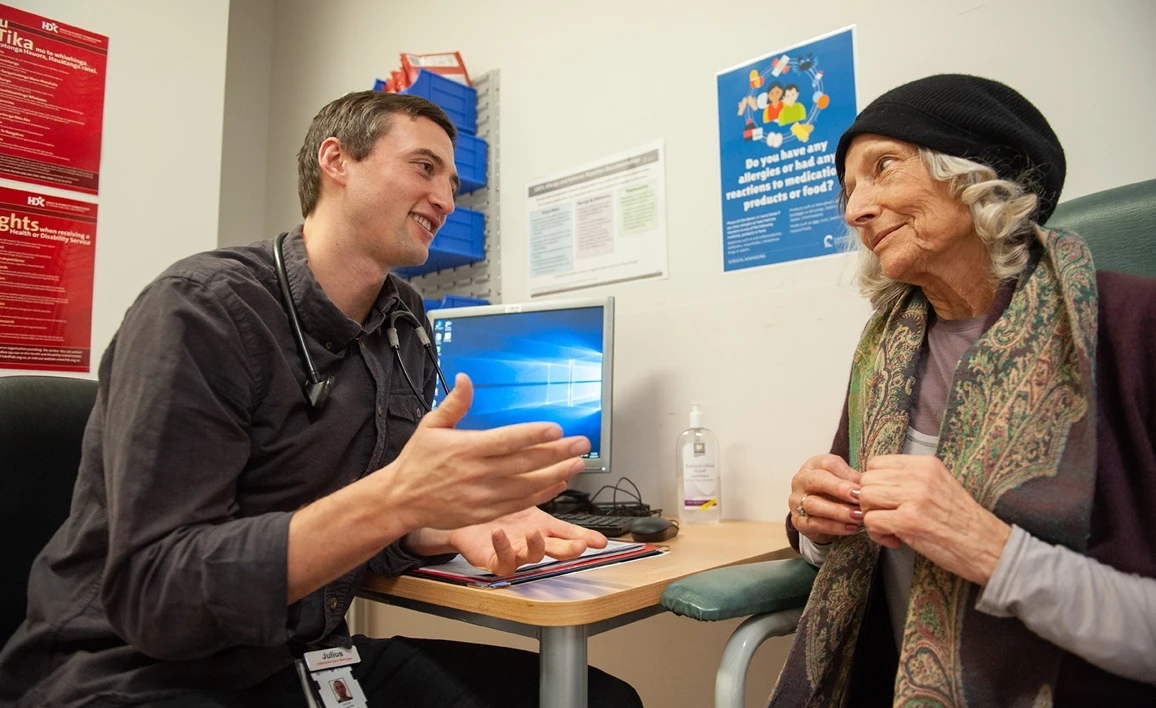 Doctor talking to patient in office