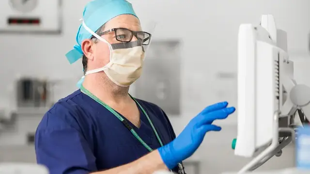 Anaesthetist looking at monitor 