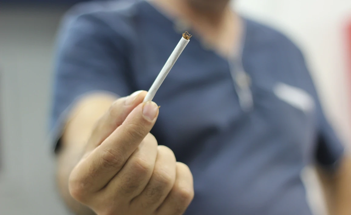Man holding a cigarette