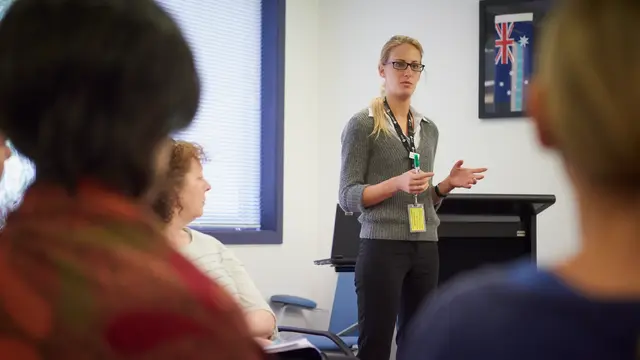 Person standing talking to audience